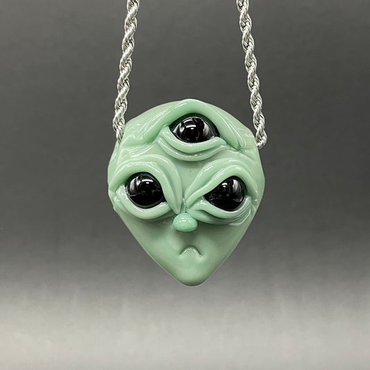 Time manipulating three eye glass alien pendant