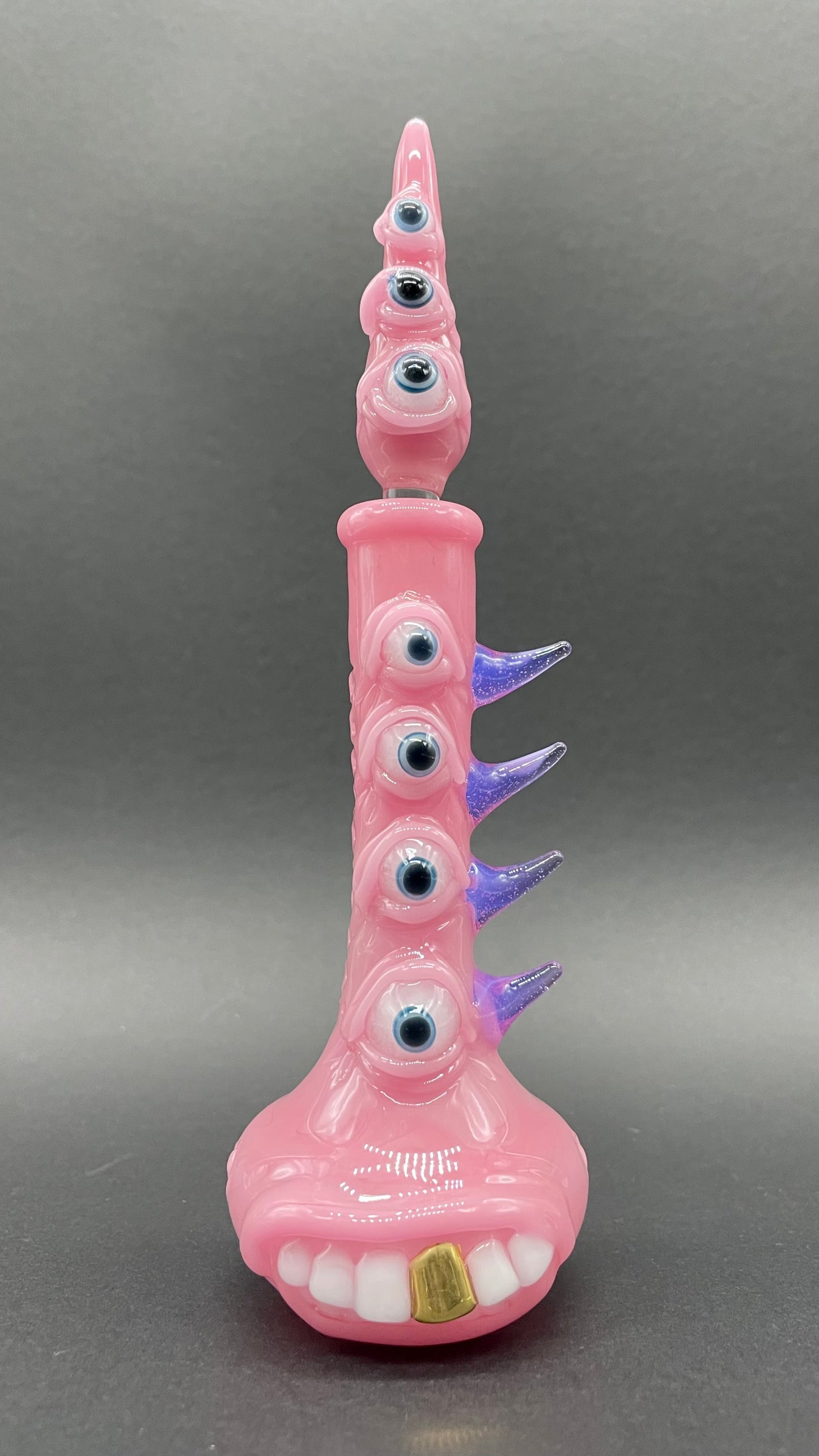 Close-up of Pink tear Pensieve - handcrafted glass