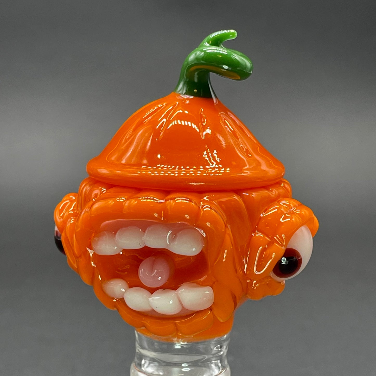 Close-up of 18mm screaming pumpkin slide - handcrafted glass