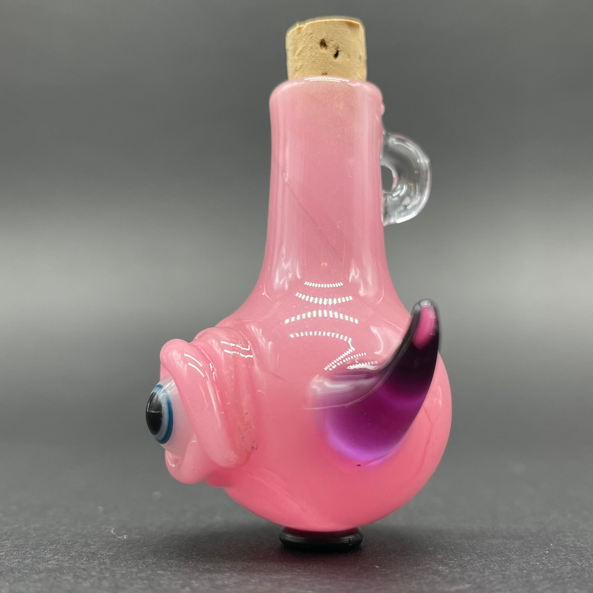 Pink cyclops potion bottle craftsmanship - artisan glass work