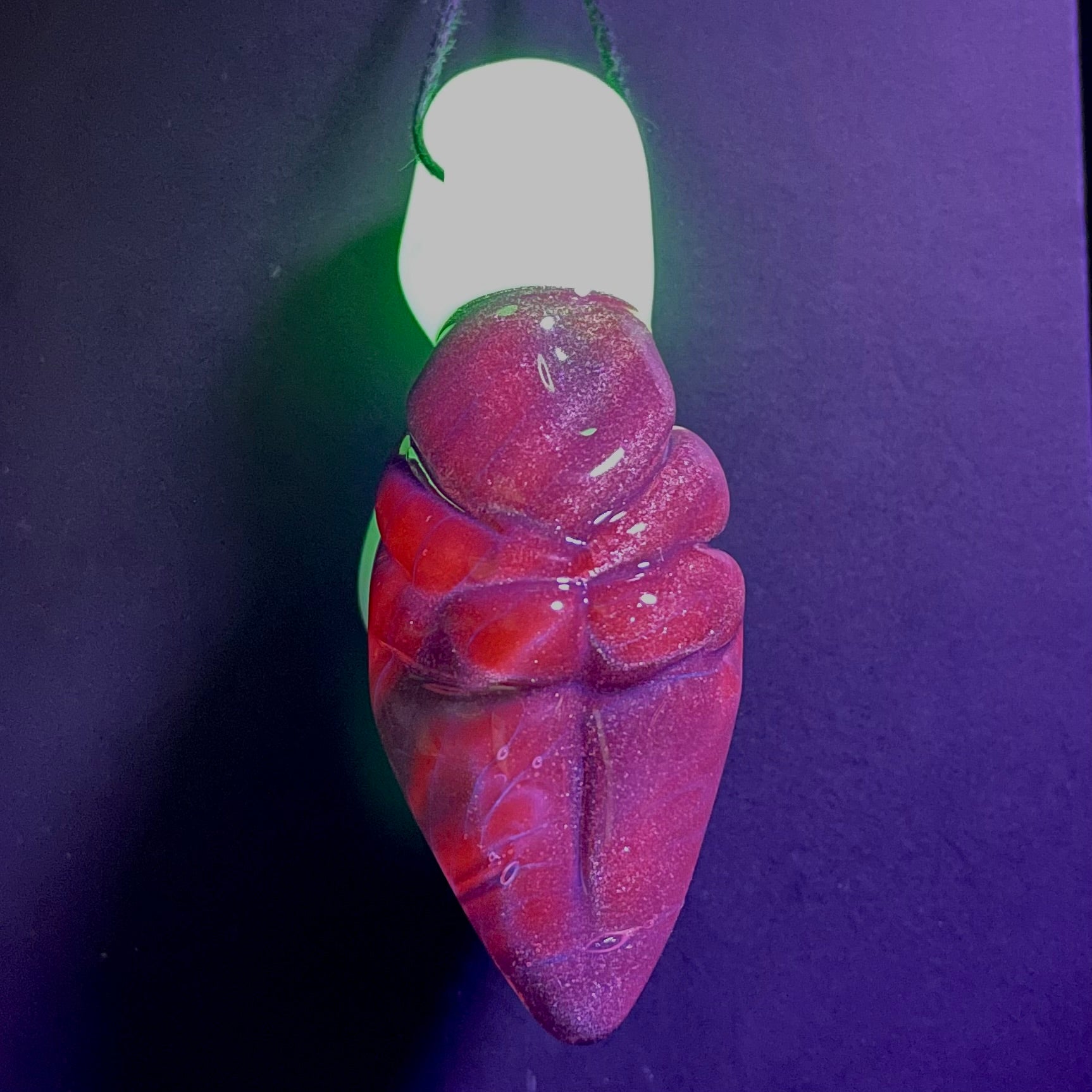 Black light reactive fertility pendant by Leviathan Glass - artisan detail