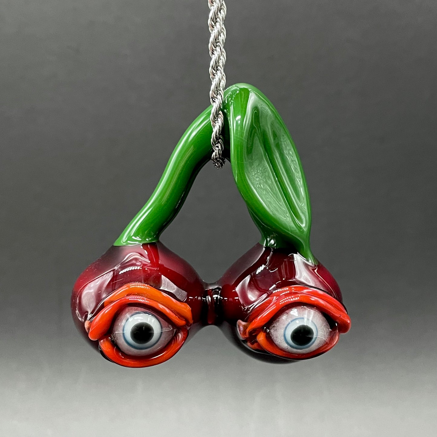 Cherry flavored glass eye pendant