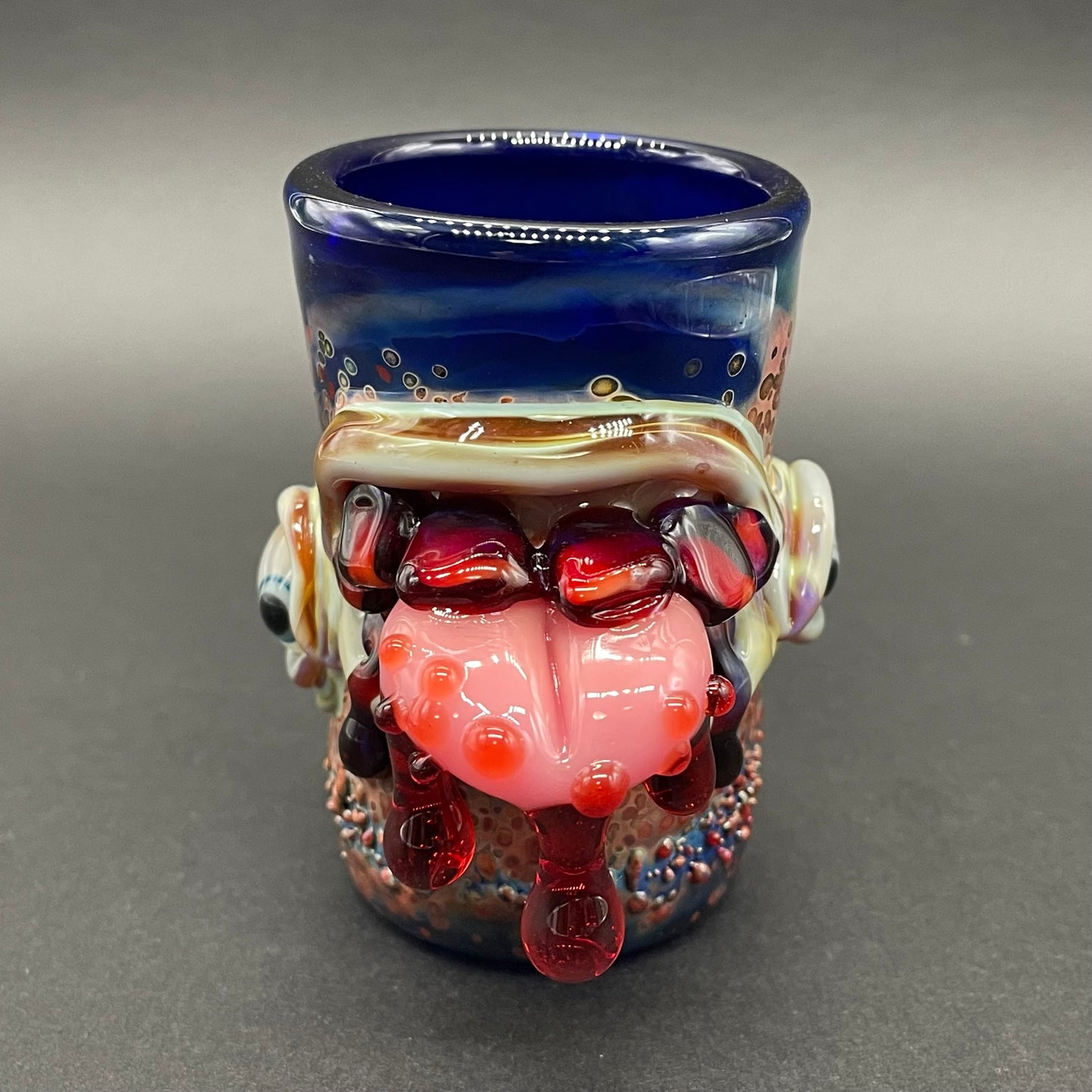 Close-up of Taste the rainbow shot glass - handcrafted glass