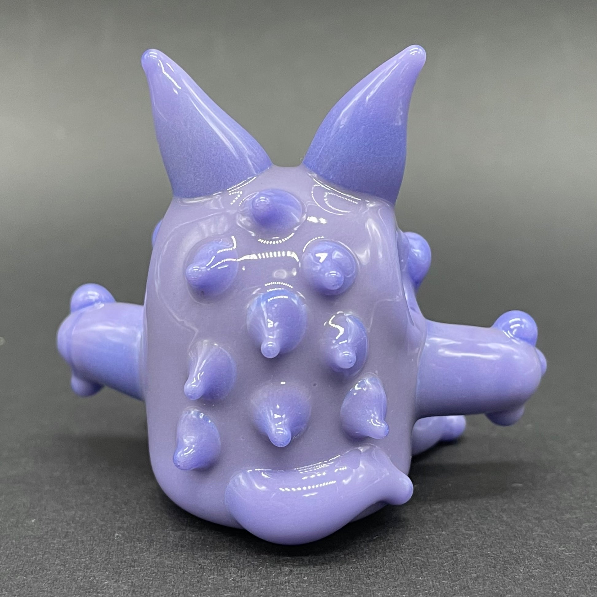 Gengar Pokémon handblown glass pendant - periwinkle purple Gengar sculpture, large red glass eyes, white teeth, clawed hands and feet, silver rope chain - Leviathan Glass