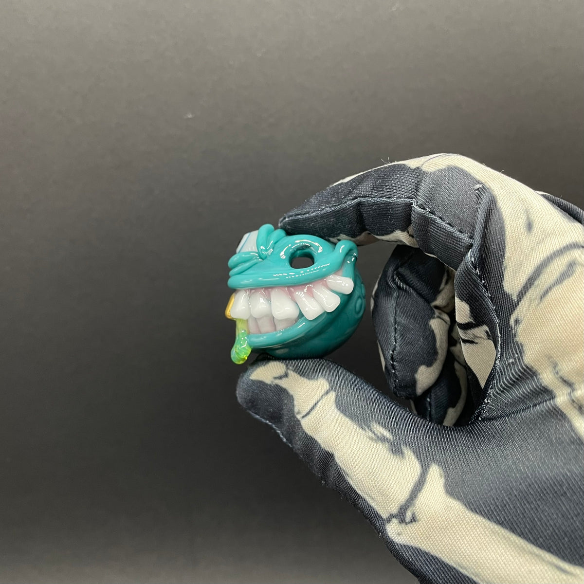 Grinning Like a Fool handblown glass pendant - oversized grinning monster face, white teeth, gold tooth, opal accents, silver rope chain - Leviathan Glass
