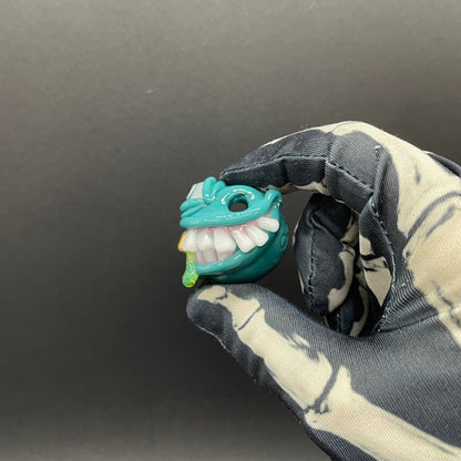 Grinning Like a Fool handblown glass pendant - oversized grinning monster face, white teeth, gold tooth, opal accents, silver rope chain - Leviathan Glass