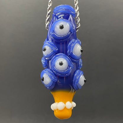 Marge Simpson Mutant handblown glass pendant - yellow Marge Simpson face with towering stack of blue cyclops creatures forming her hair, white pearl beads, silver rope chain - Leviathan Glass