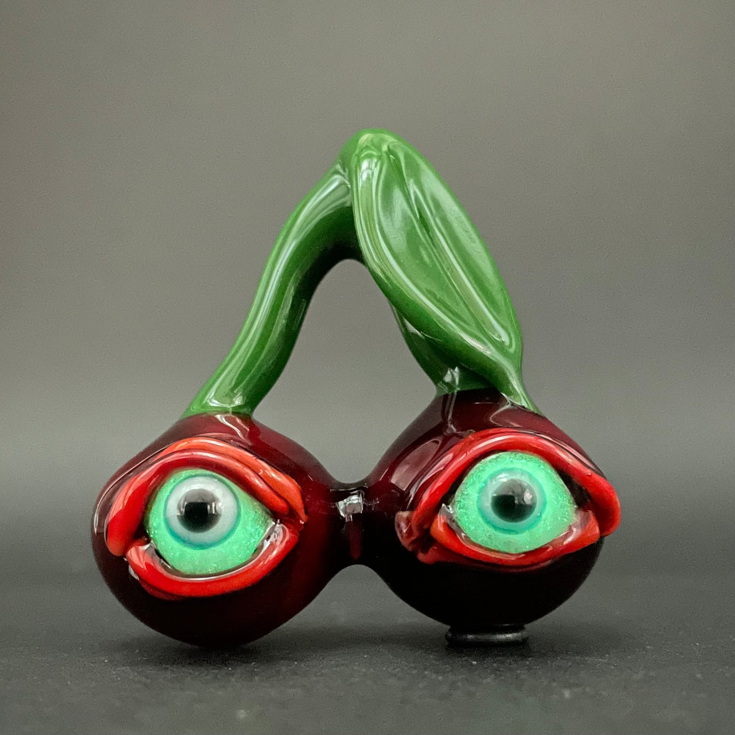 Cherry flavored glass eye pendant