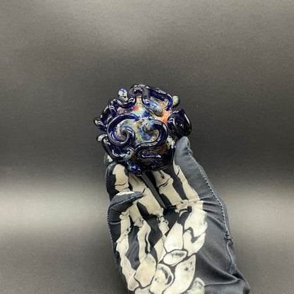 Close-up of Worm Globe ornament - handcrafted glass