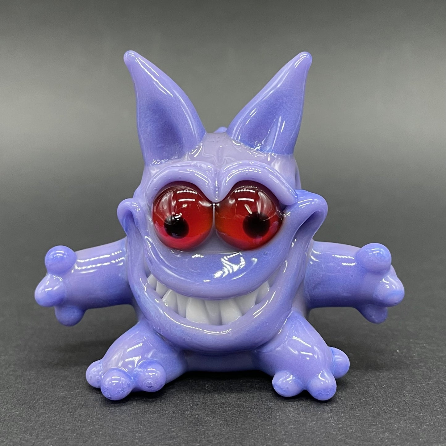 Gengar Pokémon handblown glass pendant - periwinkle purple Gengar sculpture, large red glass eyes, white teeth, clawed hands and feet, silver rope chain - Leviathan Glass