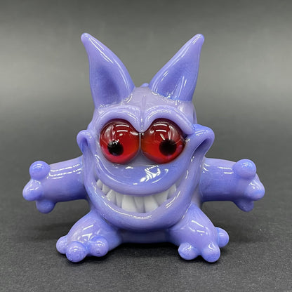 Gengar Pokémon handblown glass pendant - periwinkle purple Gengar sculpture, large red glass eyes, white teeth, clawed hands and feet, silver rope chain - Leviathan Glass