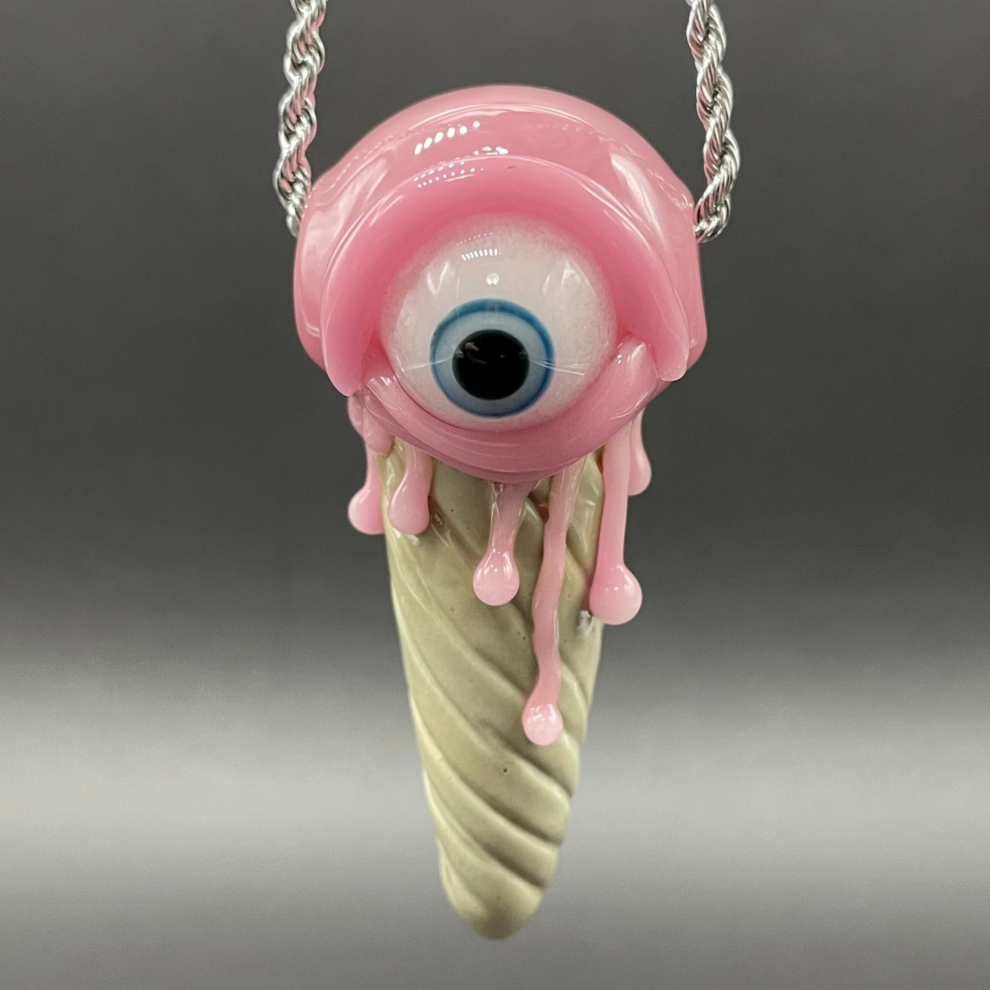 Close-up of Eye scream cone pendant - handcrafted glass