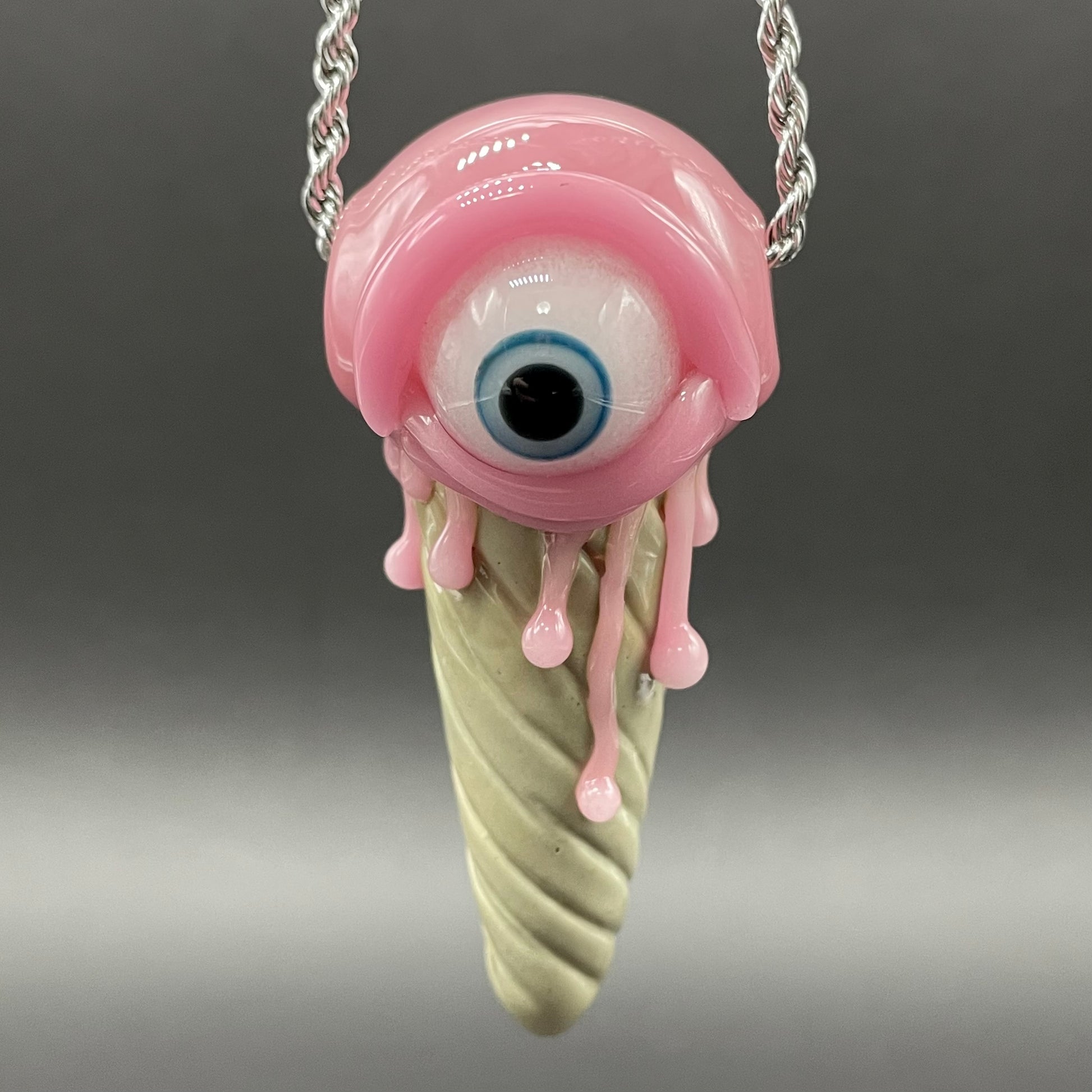 Close-up of Eye scream cone pendant - handcrafted glass