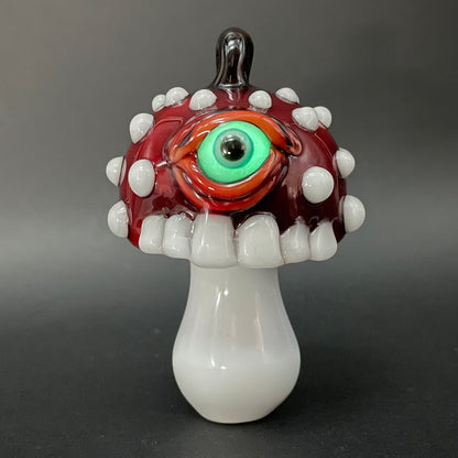 Close-up of Cyclops mushroom ornament - handcrafted glass