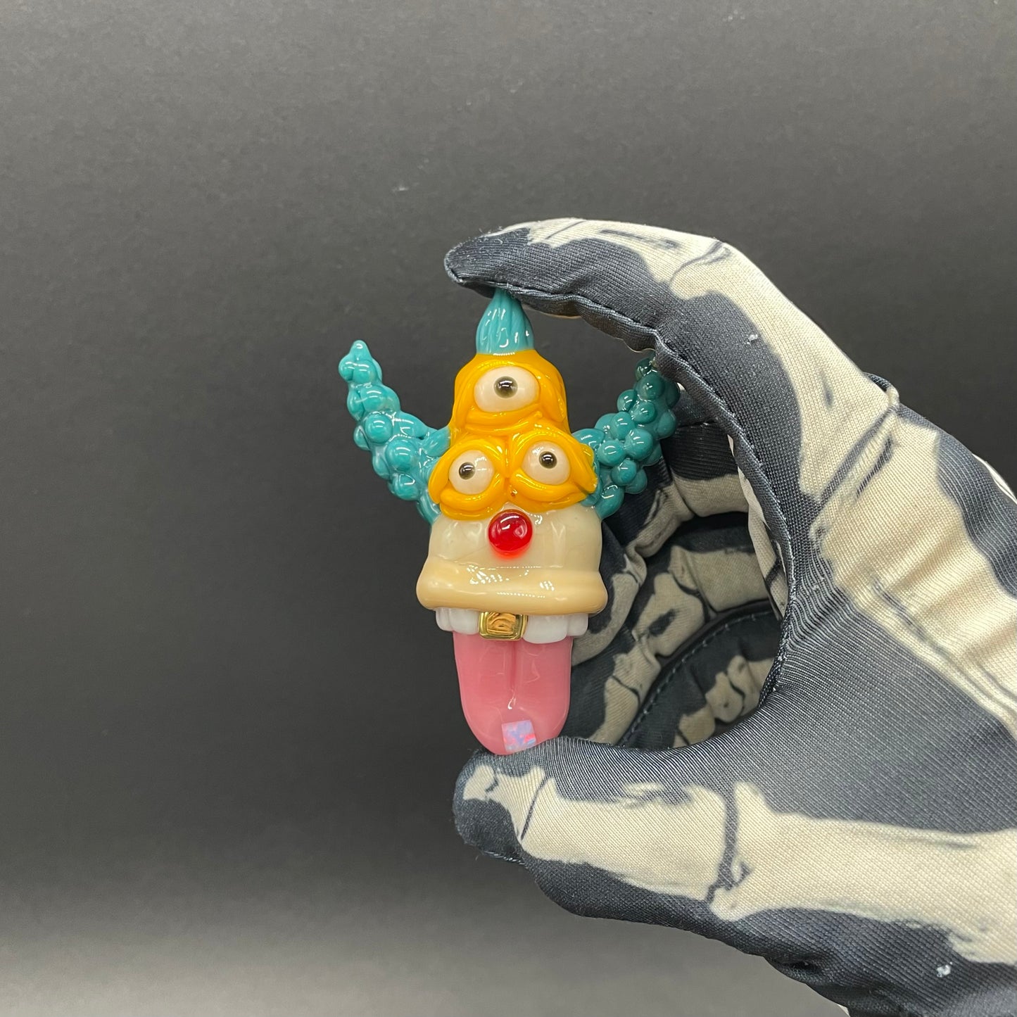 Krusty the Clown handblown glass pendant - Simpsons Krusty clown face with third eye, opal tab accent, white teeth, silver rope chain - Leviathan Glass