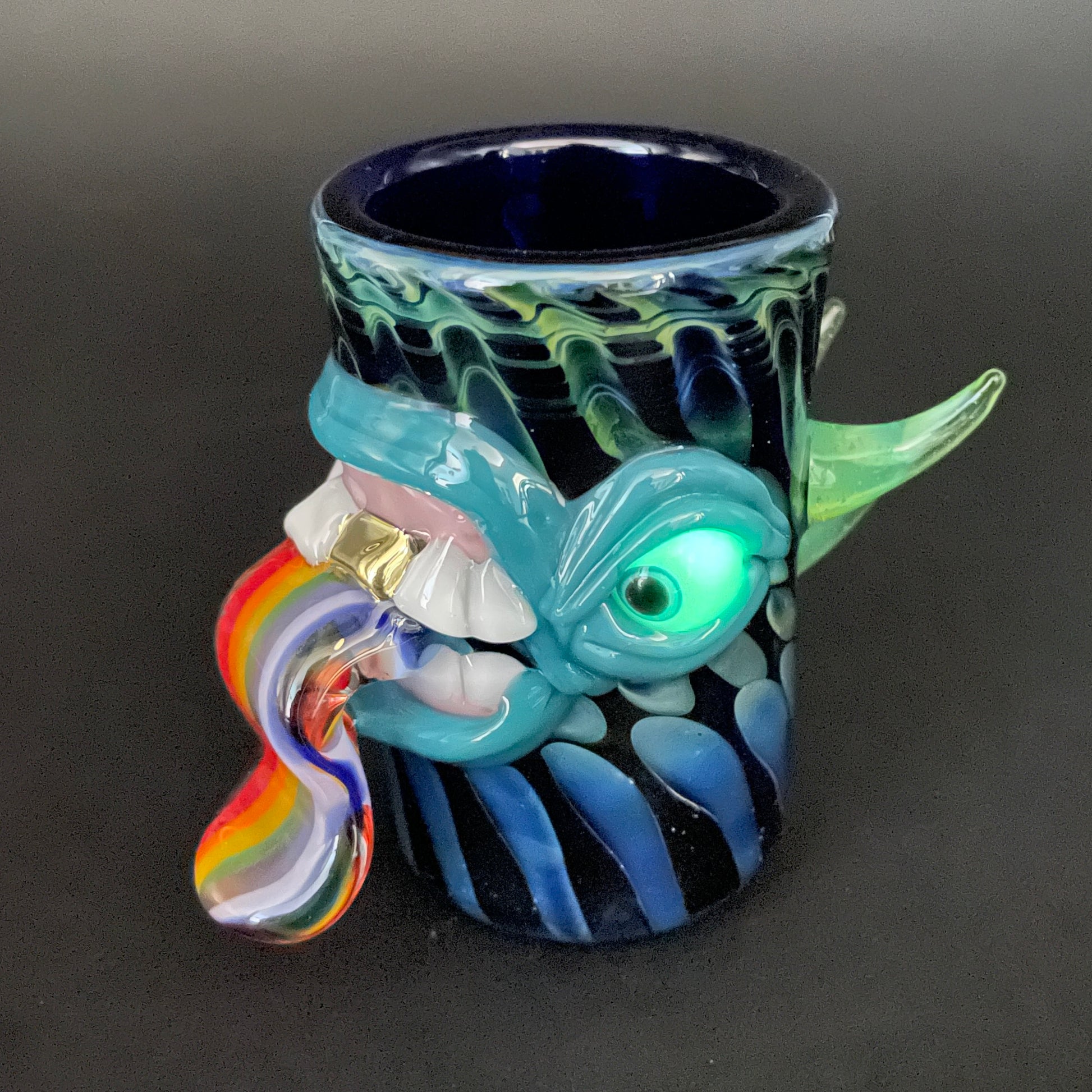 Hand-blown Hand blown kool AID tongue shot glass with gold tooth - Leviathan Glass original