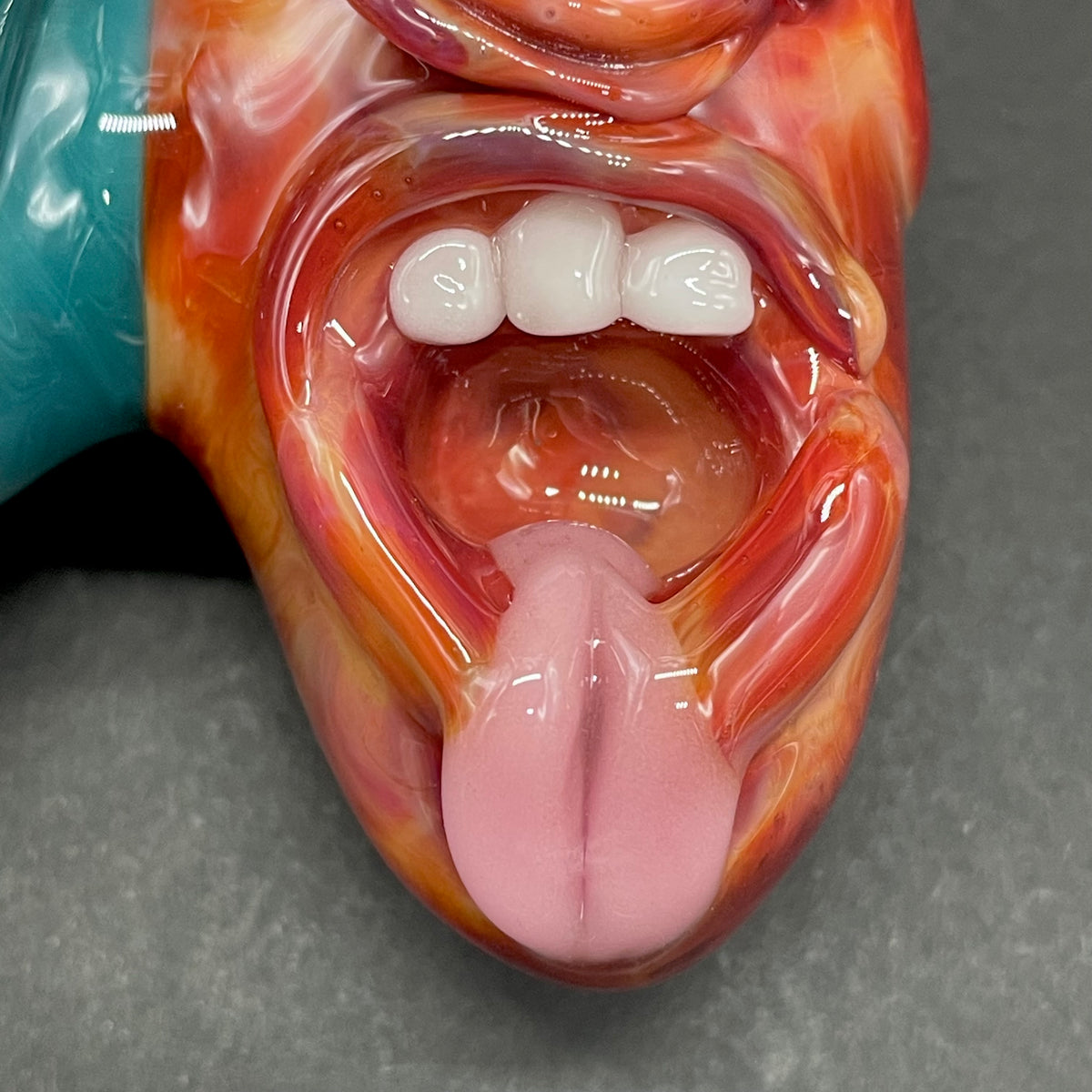 Two Headaches Are Better Than One handblown glass pendant - teal cyclops head with white teeth and green slime fused with red cyclops head with pink tongue, silver rope chain - Leviathan Glass