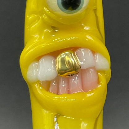 Grinning glass banana pendant