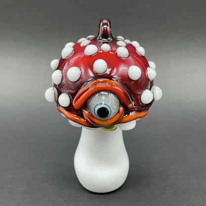 Close-up of Cyclops mushroom ornament - handcrafted glass