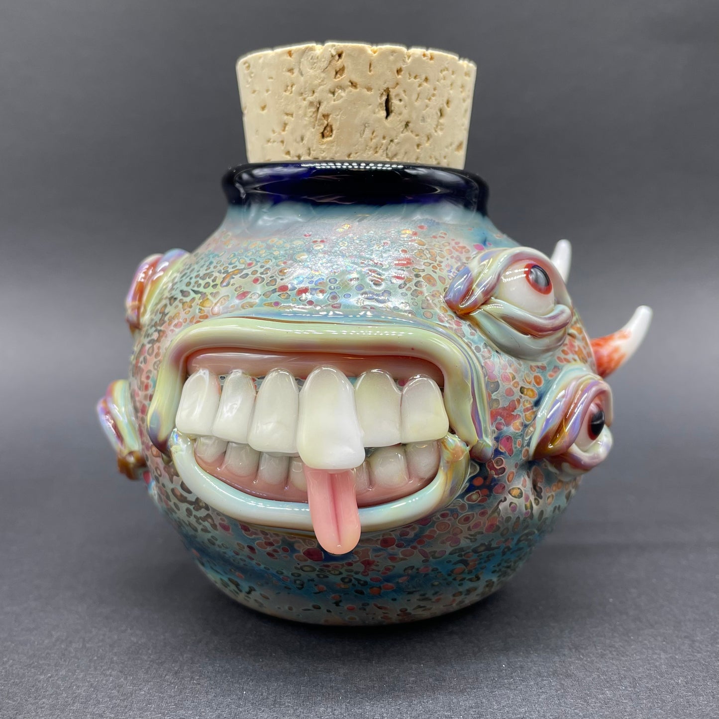 Close-up of Large bizarre glass cork jar - handcrafted glass