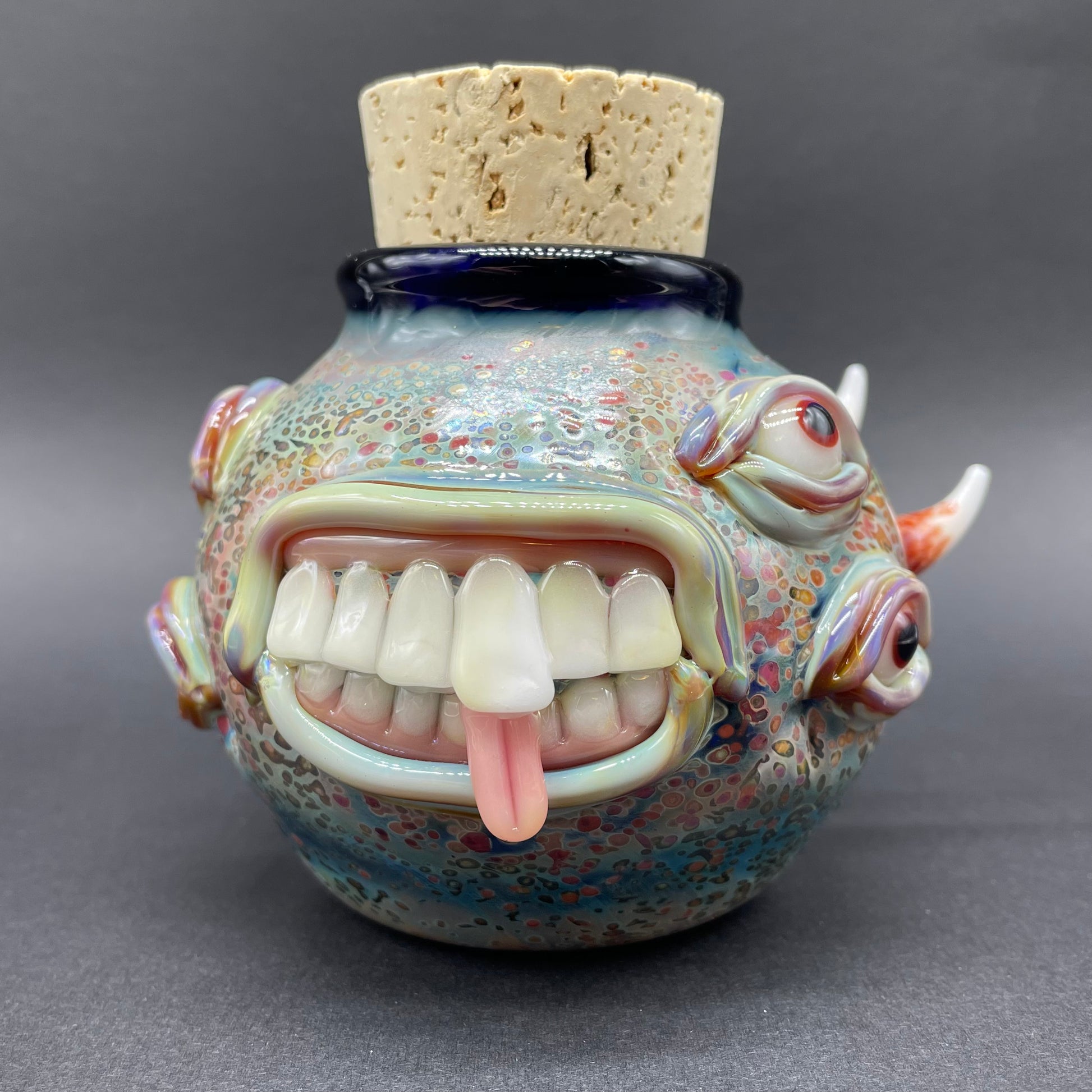 Close-up of Large bizarre glass cork jar - handcrafted glass