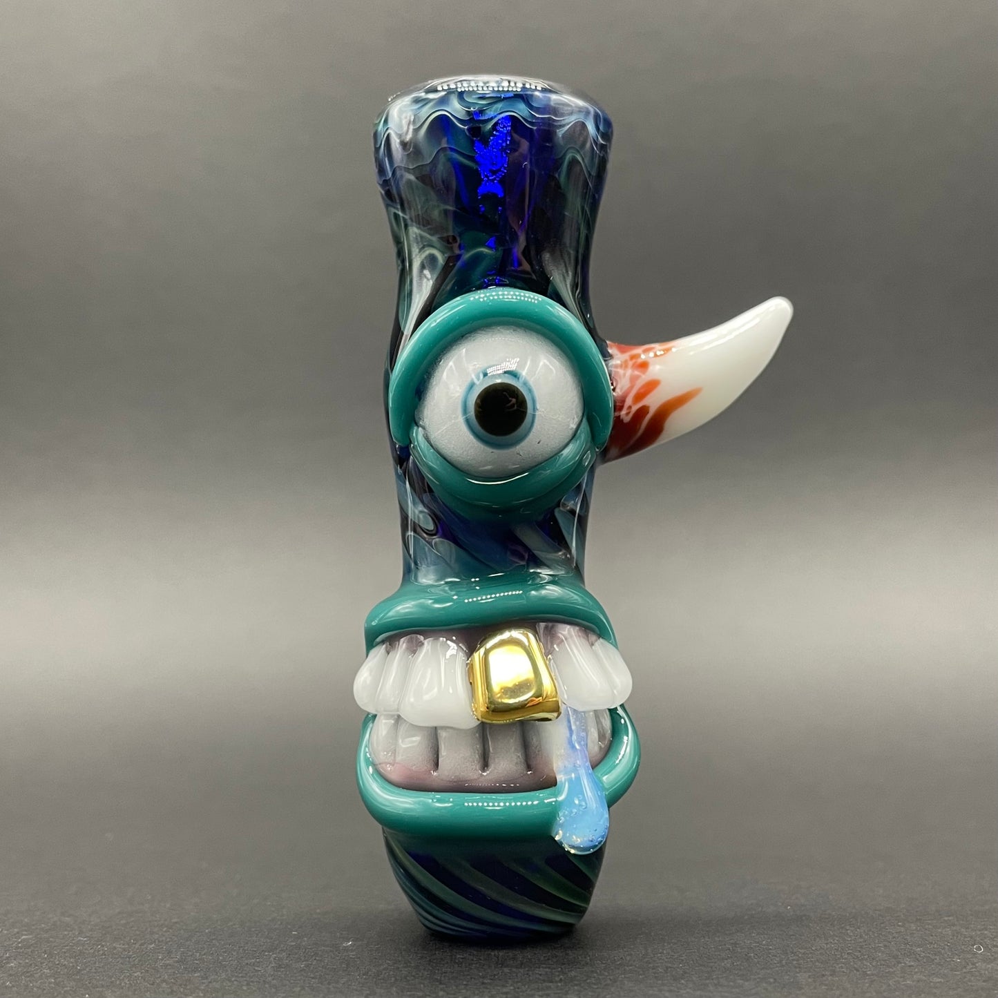 Gold fumed cyclops Chillum detail view - premium glass art