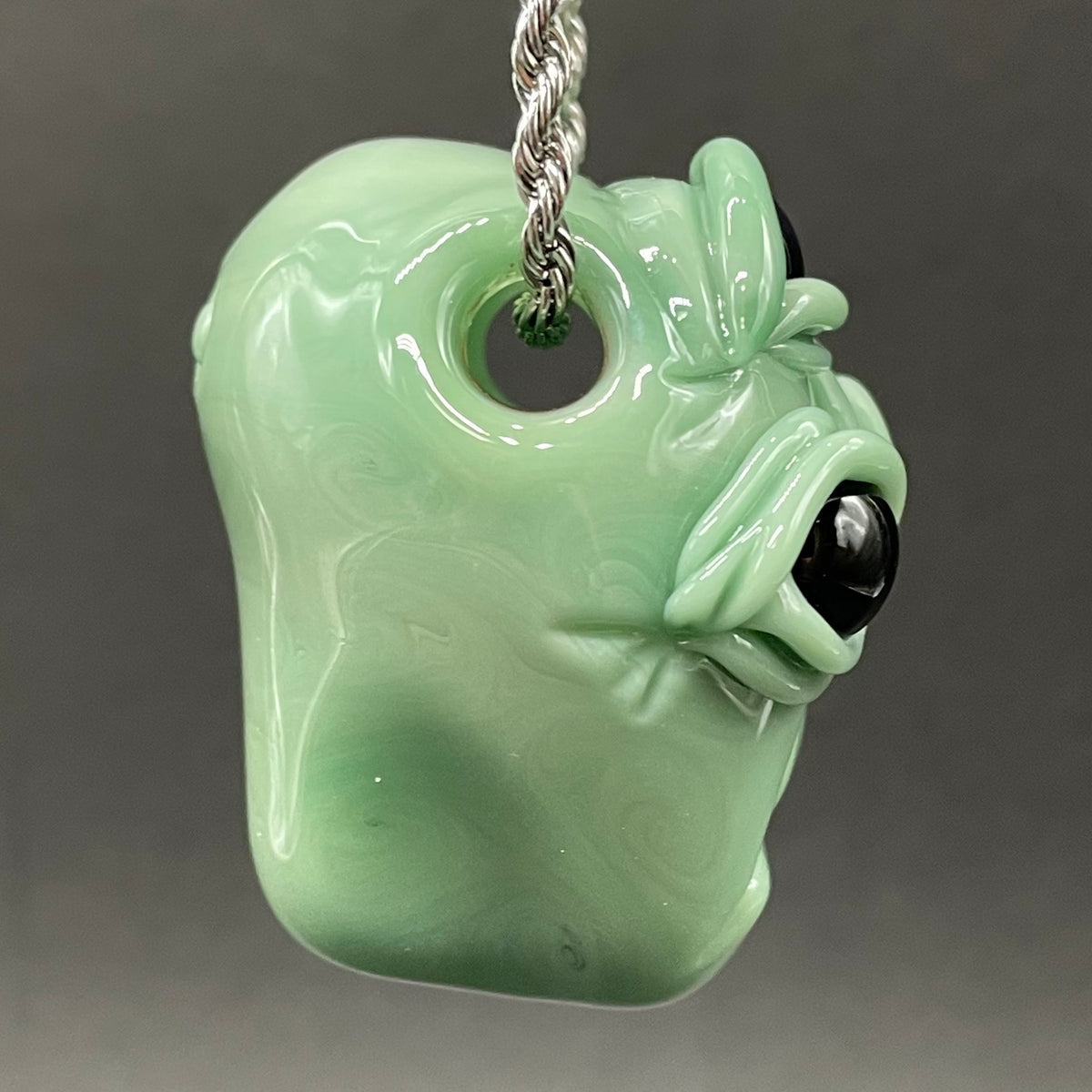 Time manipulating three eye glass alien pendant