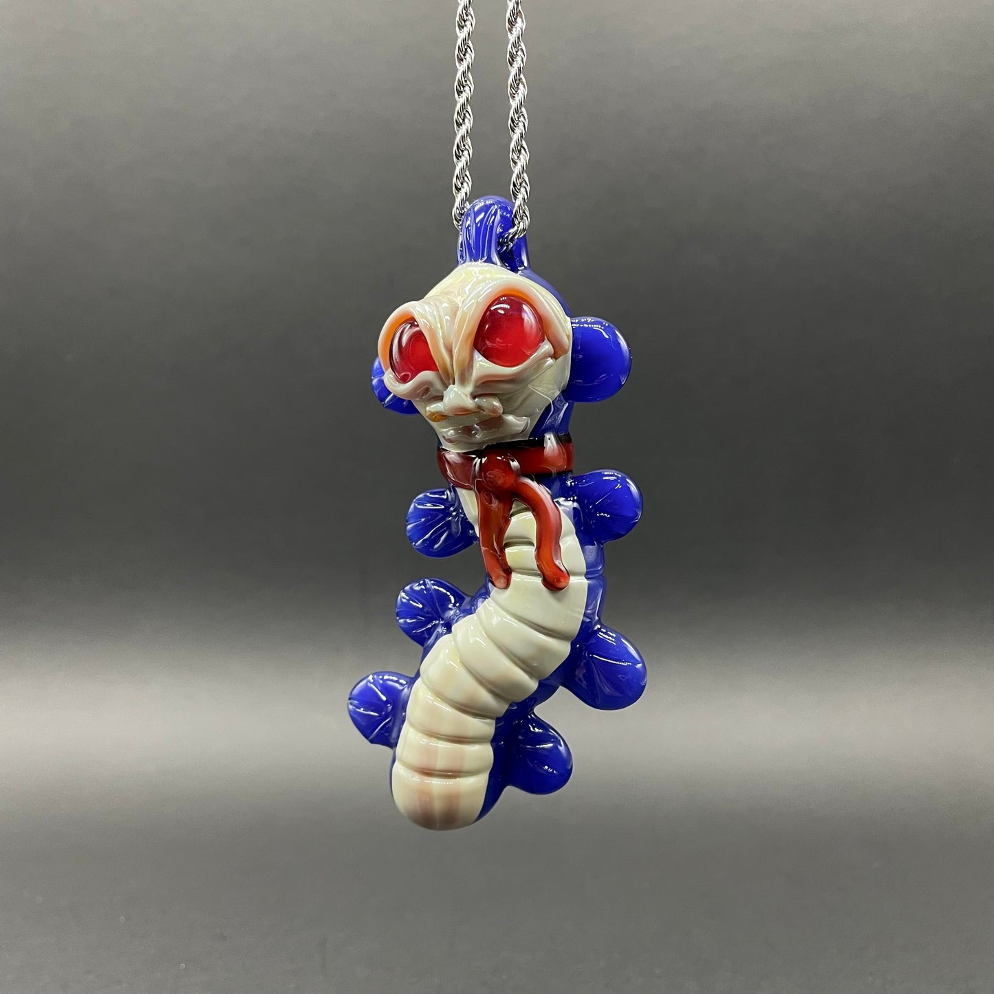 Hand-blown glass Labyrinth worm pendant by Leviathan Glass