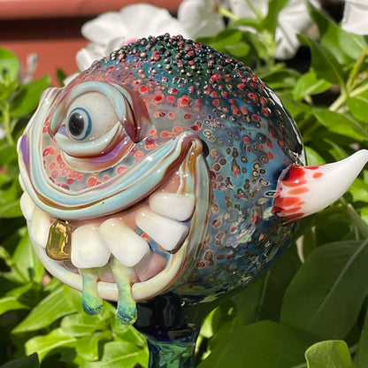 Hand Blown Glass Monster Watering Globe - round cyclops head, blue iris eye, white teeth, gold tooth, teal tongue drips, teal glass stake - Leviathan Glass