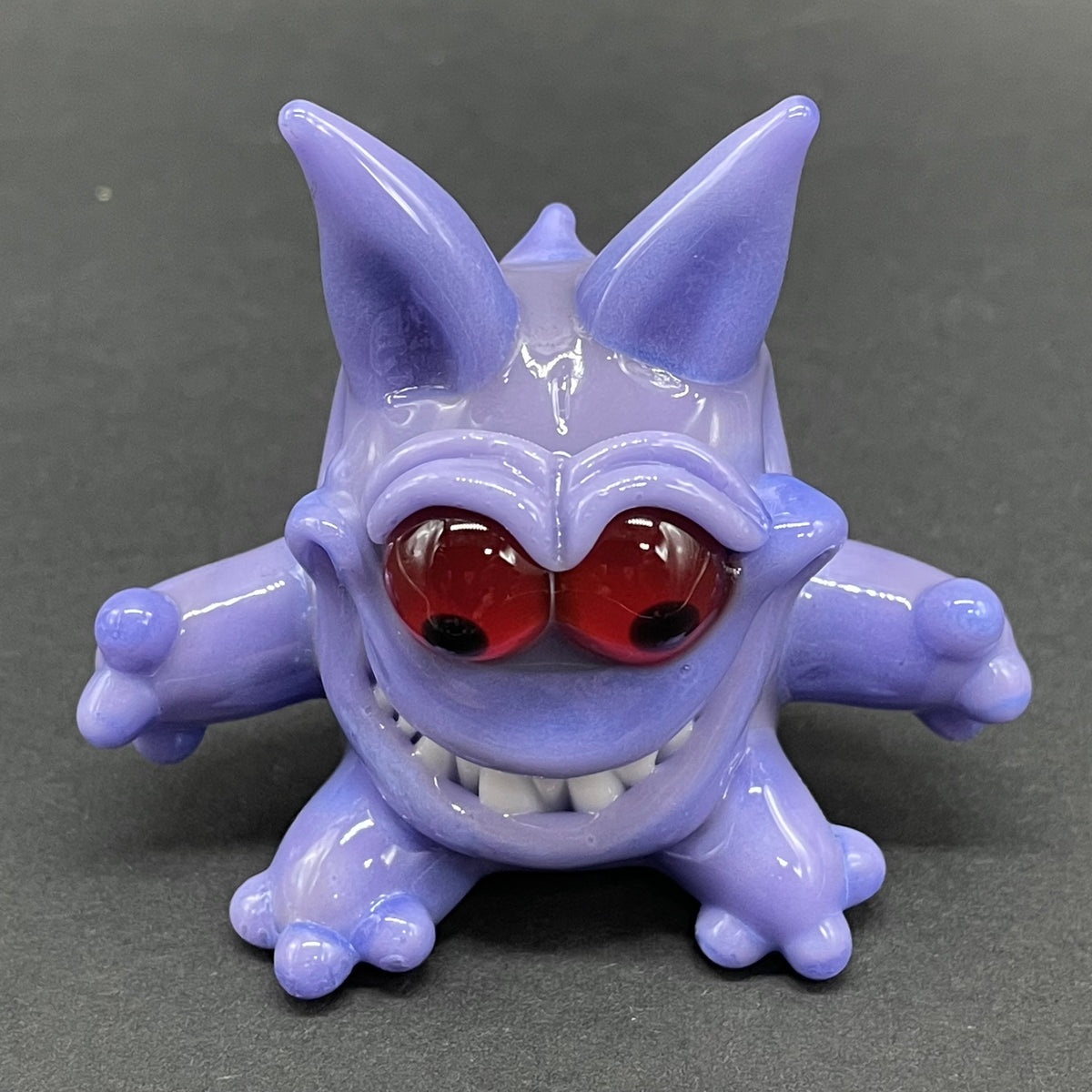 Gengar Pokémon handblown glass pendant - periwinkle purple Gengar sculpture, large red glass eyes, white teeth, clawed hands and feet, silver rope chain - Leviathan Glass