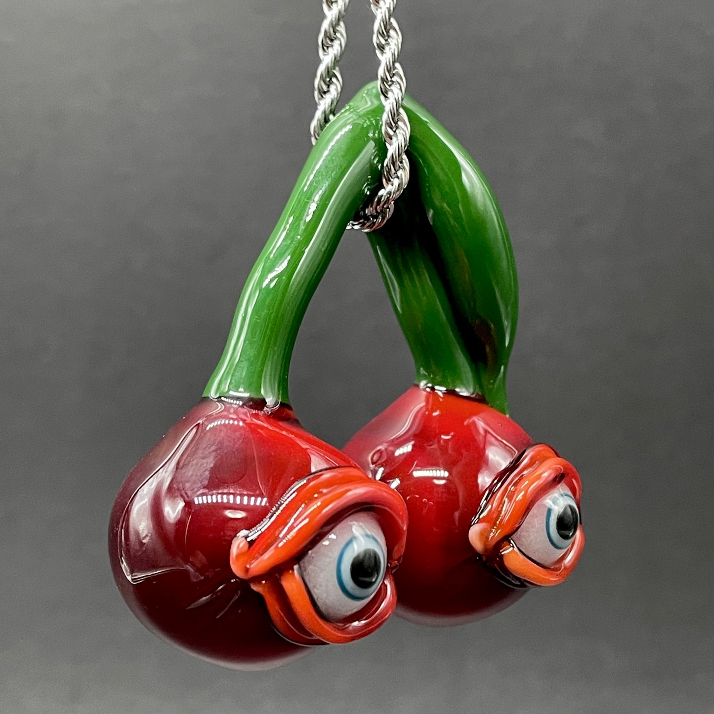 Cherry flavored glass eye pendant craftsmanship - artisan glass work