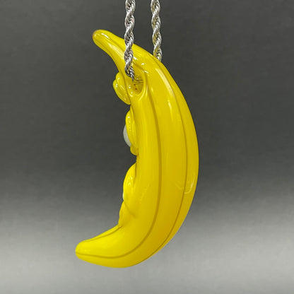 Grinning glass banana pendant