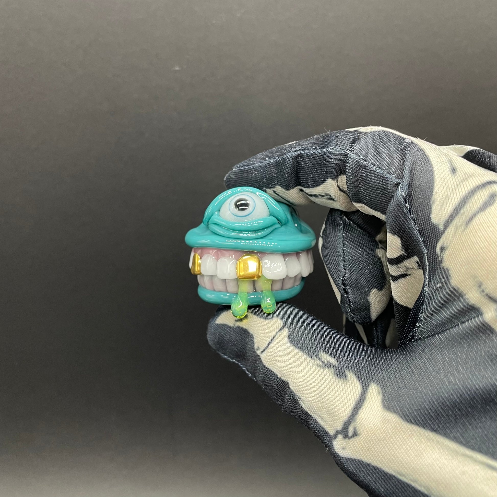 Grinning Like a Fool handblown glass pendant - oversized grinning monster face, white teeth, gold tooth, opal accents, silver rope chain - Leviathan Glass
