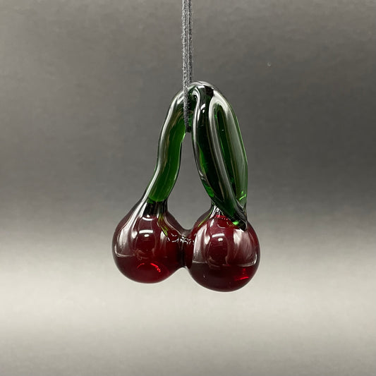 Transparent cherry pendant detail view - premium glass art