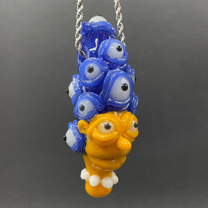 Marge Simpson Mutant handblown glass pendant - yellow Marge Simpson face with towering stack of blue cyclops creatures forming her hair, white pearl beads, silver rope chain - Leviathan Glass