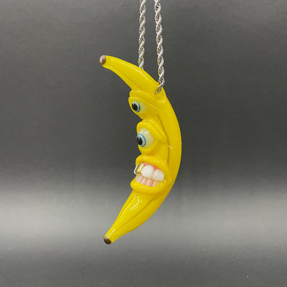 Grinning glass banana pendant