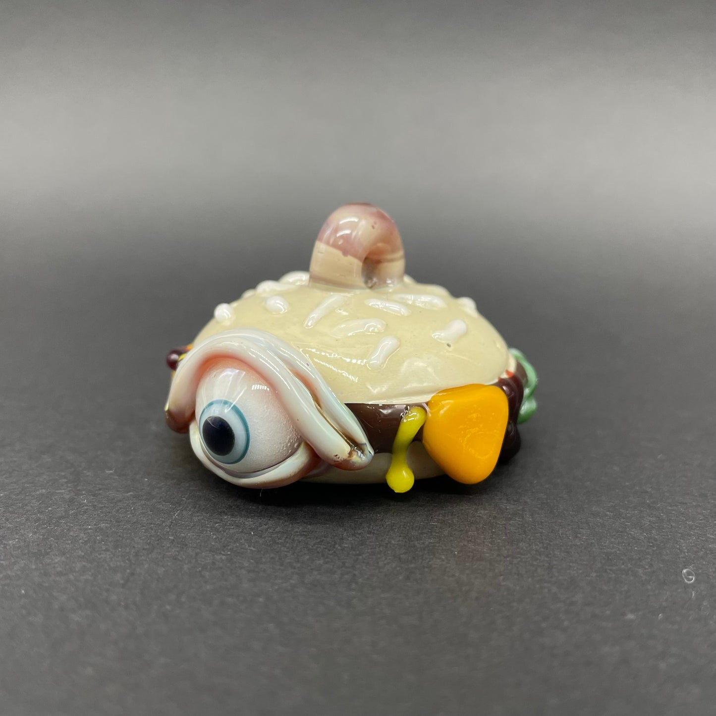 Hand-blown glass Eye love cheeseburger pendant by Leviathan Glass