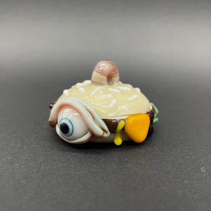 Hand-blown glass Eye love cheeseburger pendant by Leviathan Glass