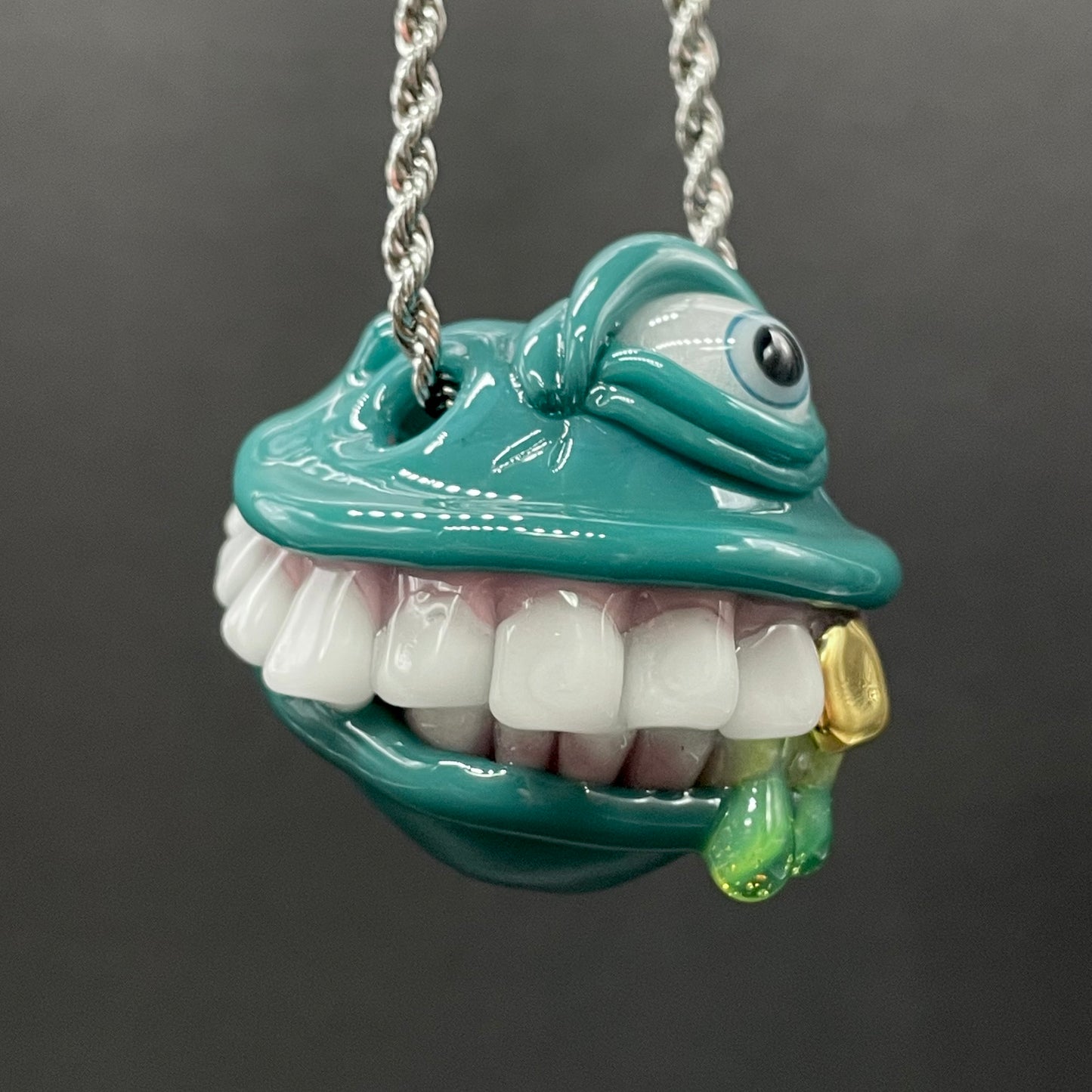 Grinning like a fool glass pendant