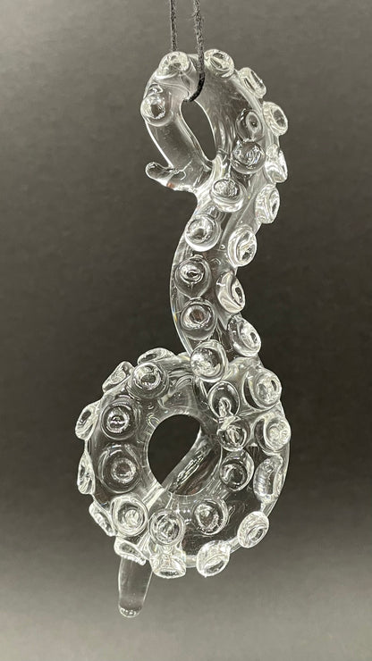 Close-up of 3 clear tentacle ornaments - handcrafted glass