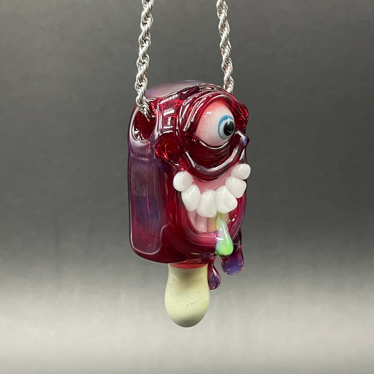 Drippy popsicle pendant detail view - premium glass art