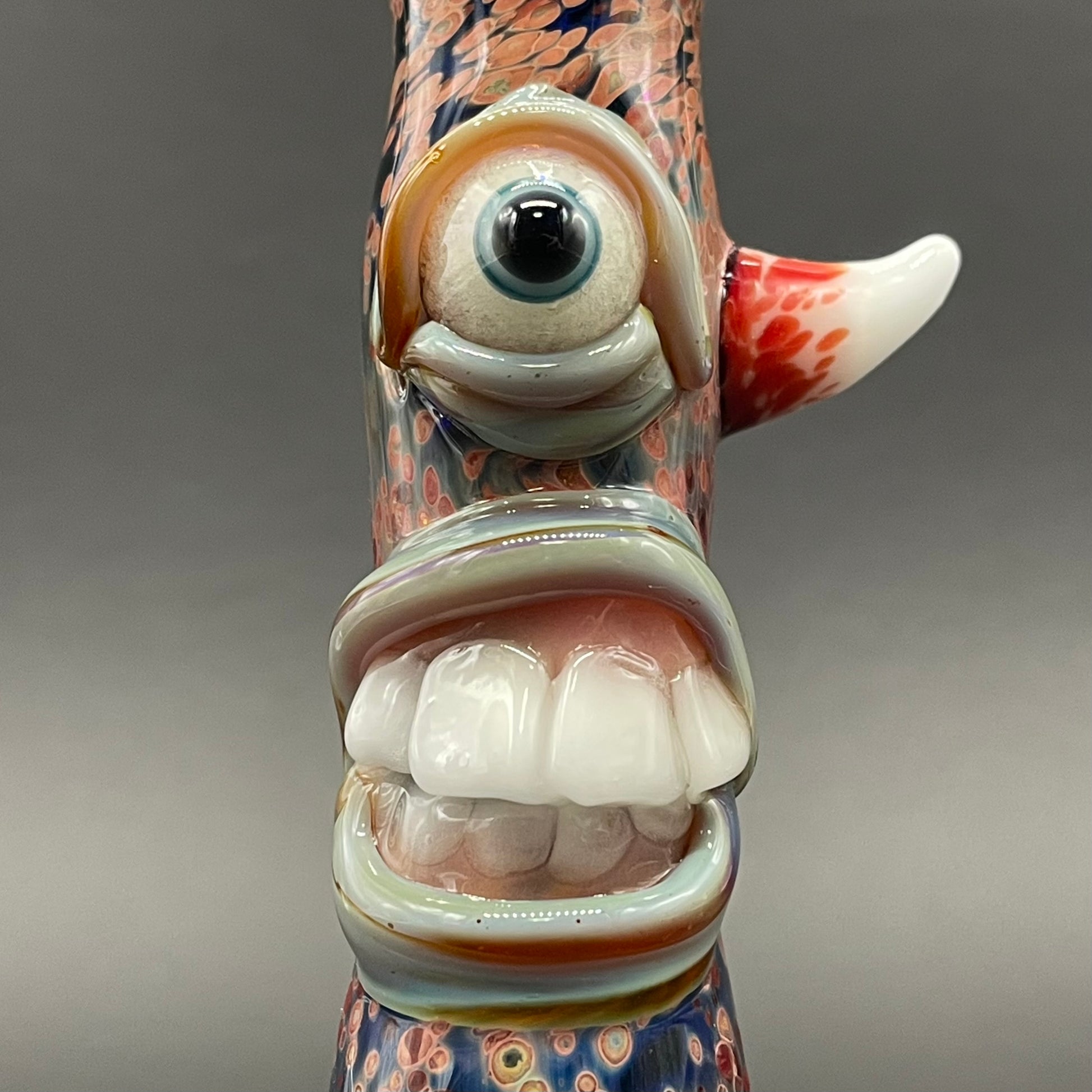 Close-up of Frit Cyclops Chillum - handcrafted glass