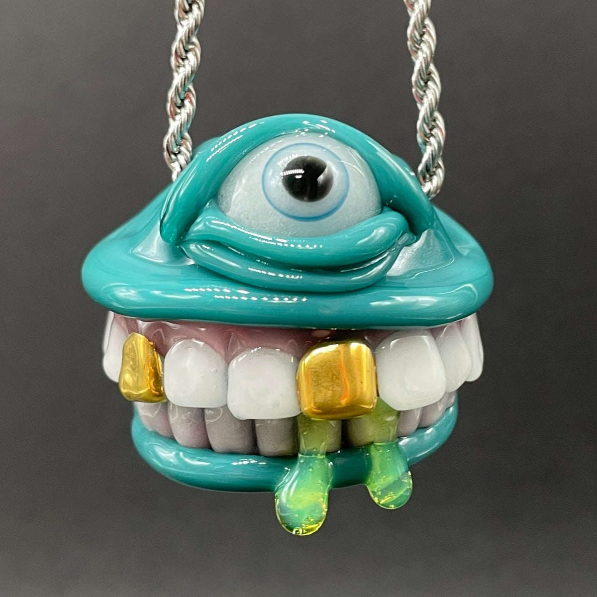 Grinning Like a Fool handblown glass pendant - oversized grinning monster face, white teeth, gold tooth, opal accents, silver rope chain - Leviathan Glass