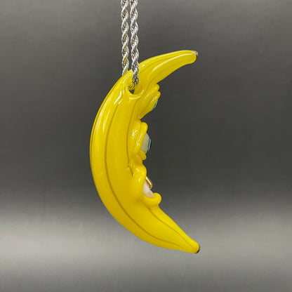 Grinning glass banana pendant