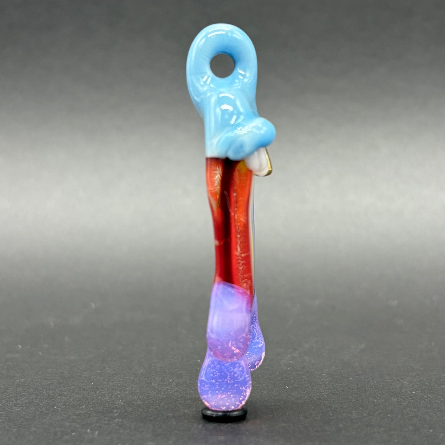 Drippy tongue rainbow tongue pendant by Leviathan Glass - artisan detail