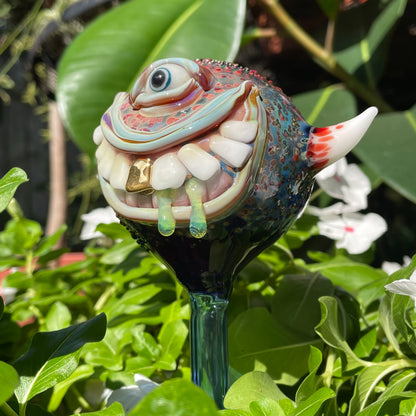 Hand Blown Glass Monster Watering Globe - round cyclops head, blue iris eye, white teeth, gold tooth, teal tongue drips, teal glass stake - Leviathan Glass