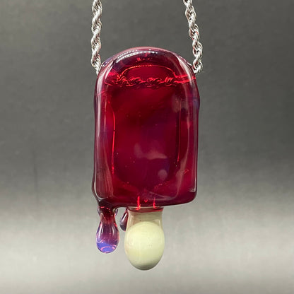 Close-up of Drippy popsicle pendant - handcrafted glass