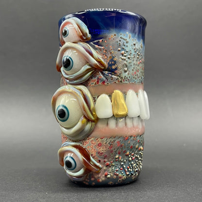 Close-up of Too many teeth shot glass - handcrafted glass
