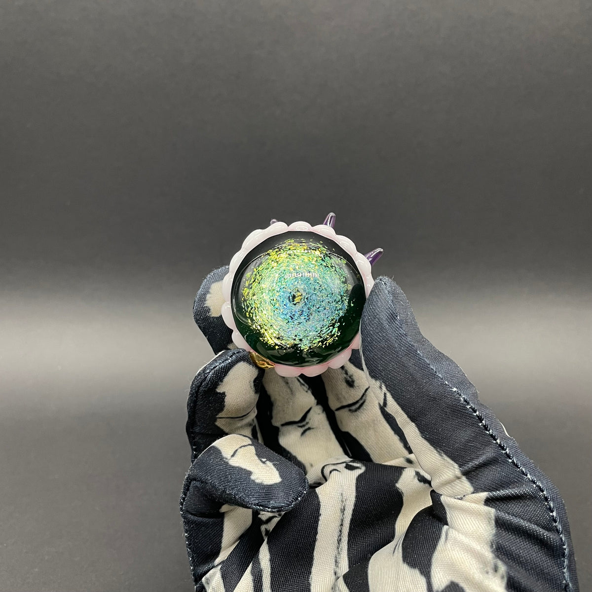Close-up of Hungry Dichroic marble - handcrafted glass