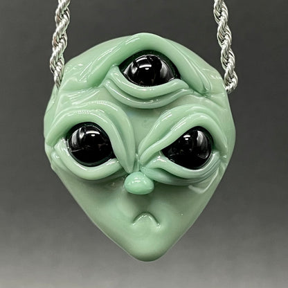 Time manipulating three eye glass alien pendant